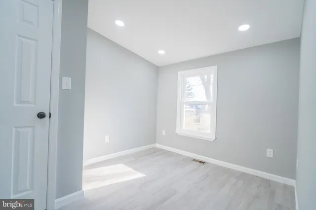 a view of empty room with windows