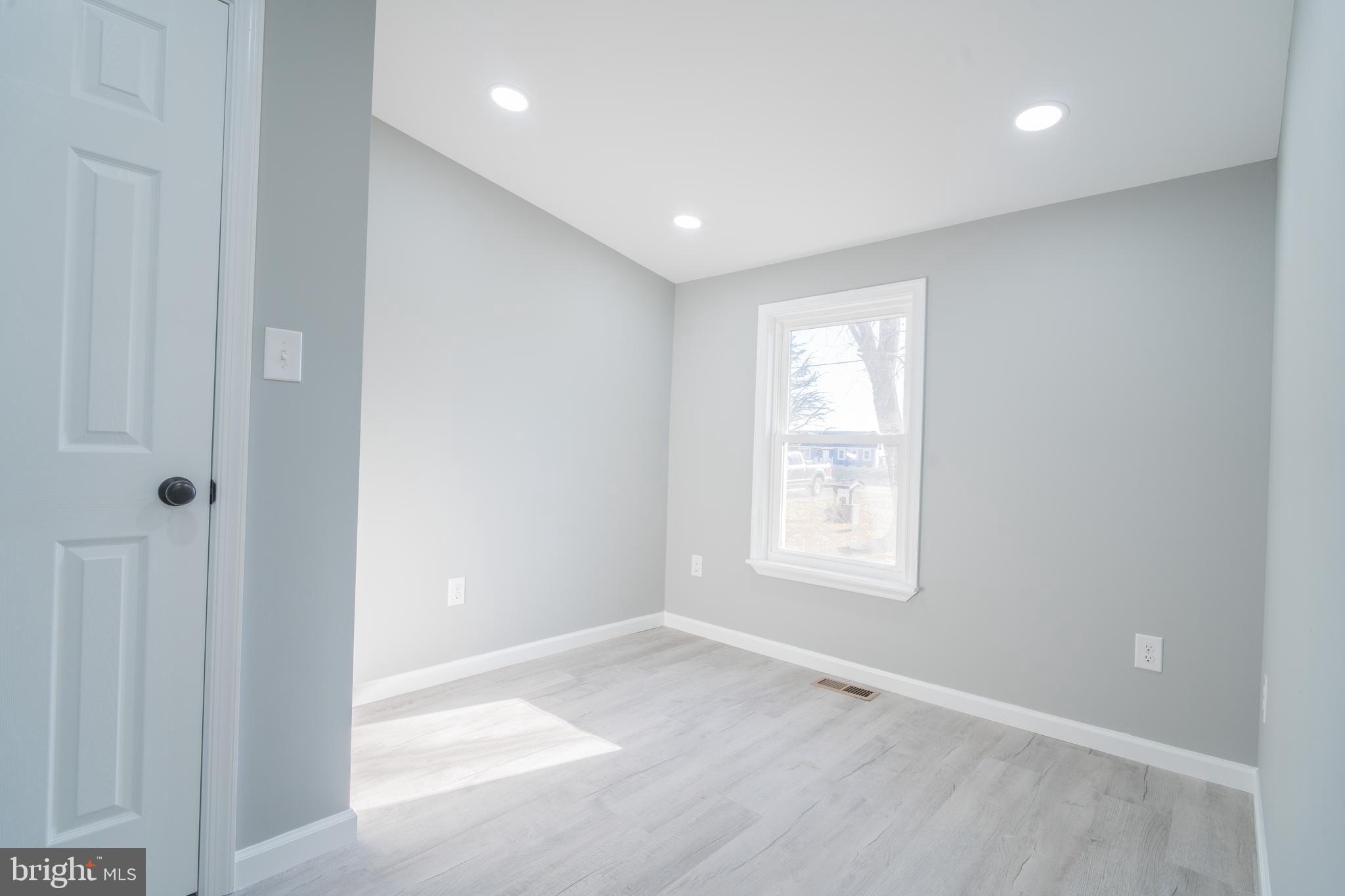 12579 Whitesville Road Laurel, DE 19956 - Photo 11 of 25 a view of empty room with windows