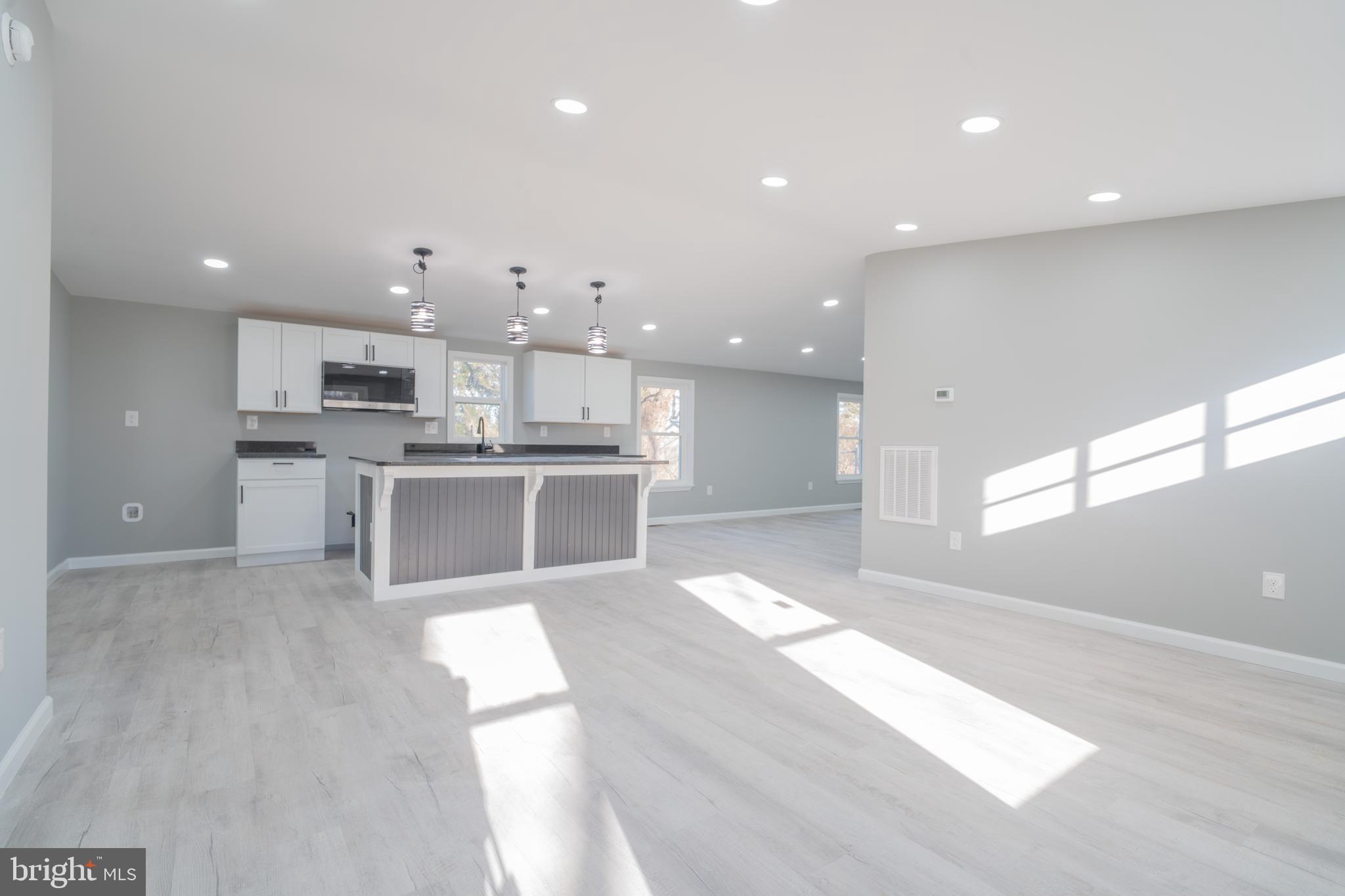 12579 Whitesville Road Laurel, DE 19956 - Photo 13 of 25 a view of kitchen with kitchen island sink refrigerator and cabinets