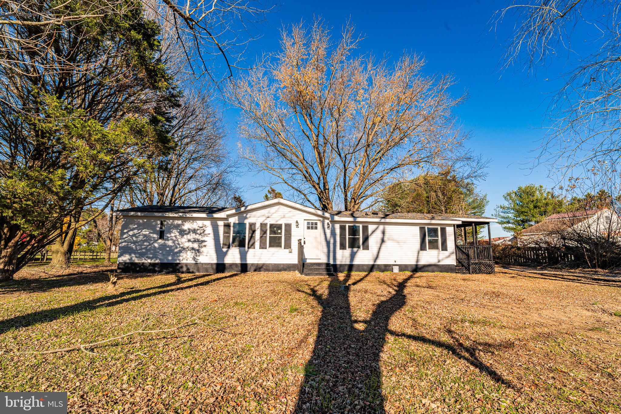 12579 Whitesville Road Laurel, DE 19956 - Photo 3 of 25 a front view of a house with a yard