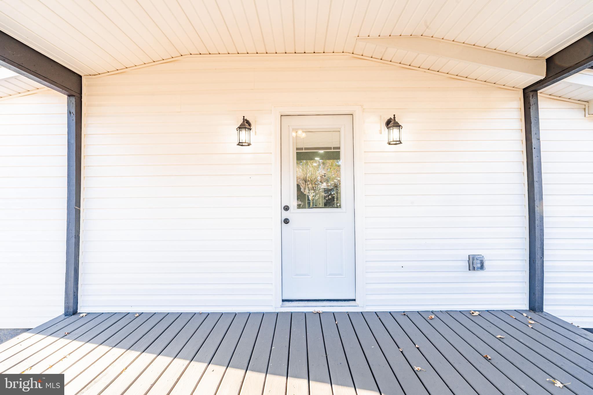 12579 Whitesville Road Laurel, DE 19956 - Photo 6 of 25 a view of a balcony with wooden floor