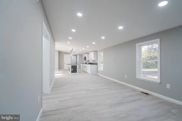 a view of a kitchen with a sink and cabinets