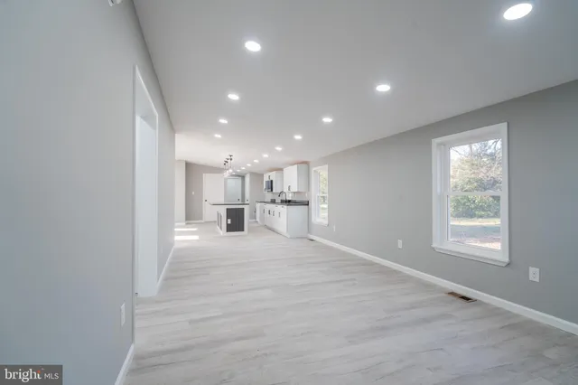 a view of a kitchen with a sink and cabinets