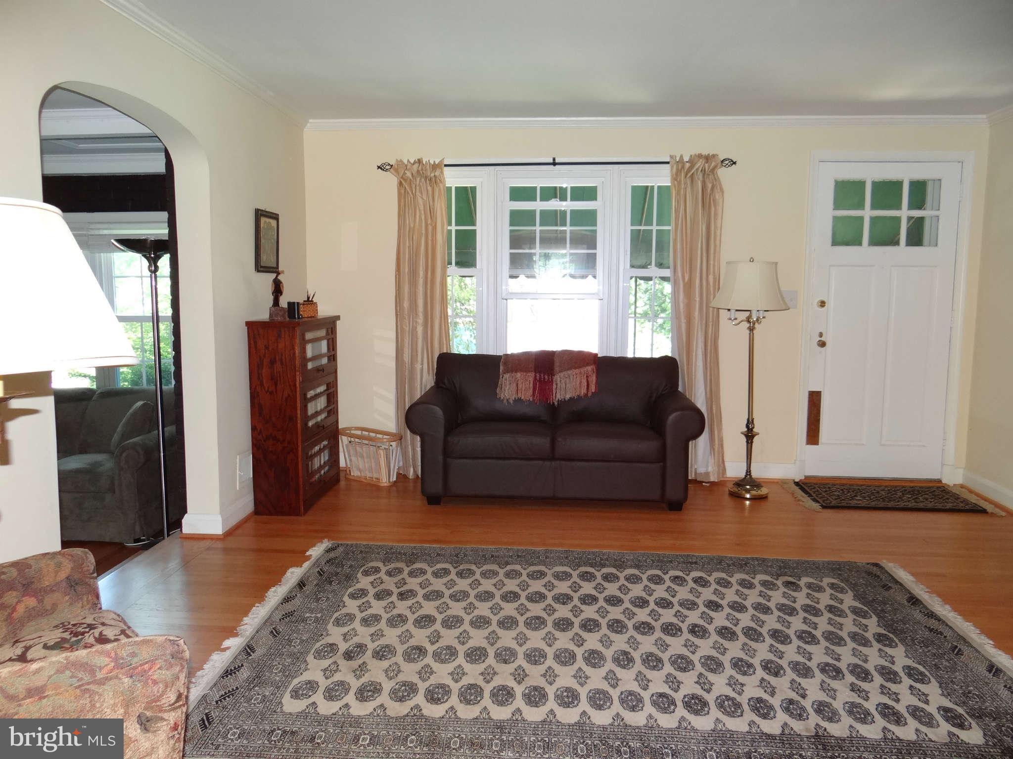 101 Stanmore Road Baltimore, MD 21212 - Photo 2 of 25 a living room with furniture and a window