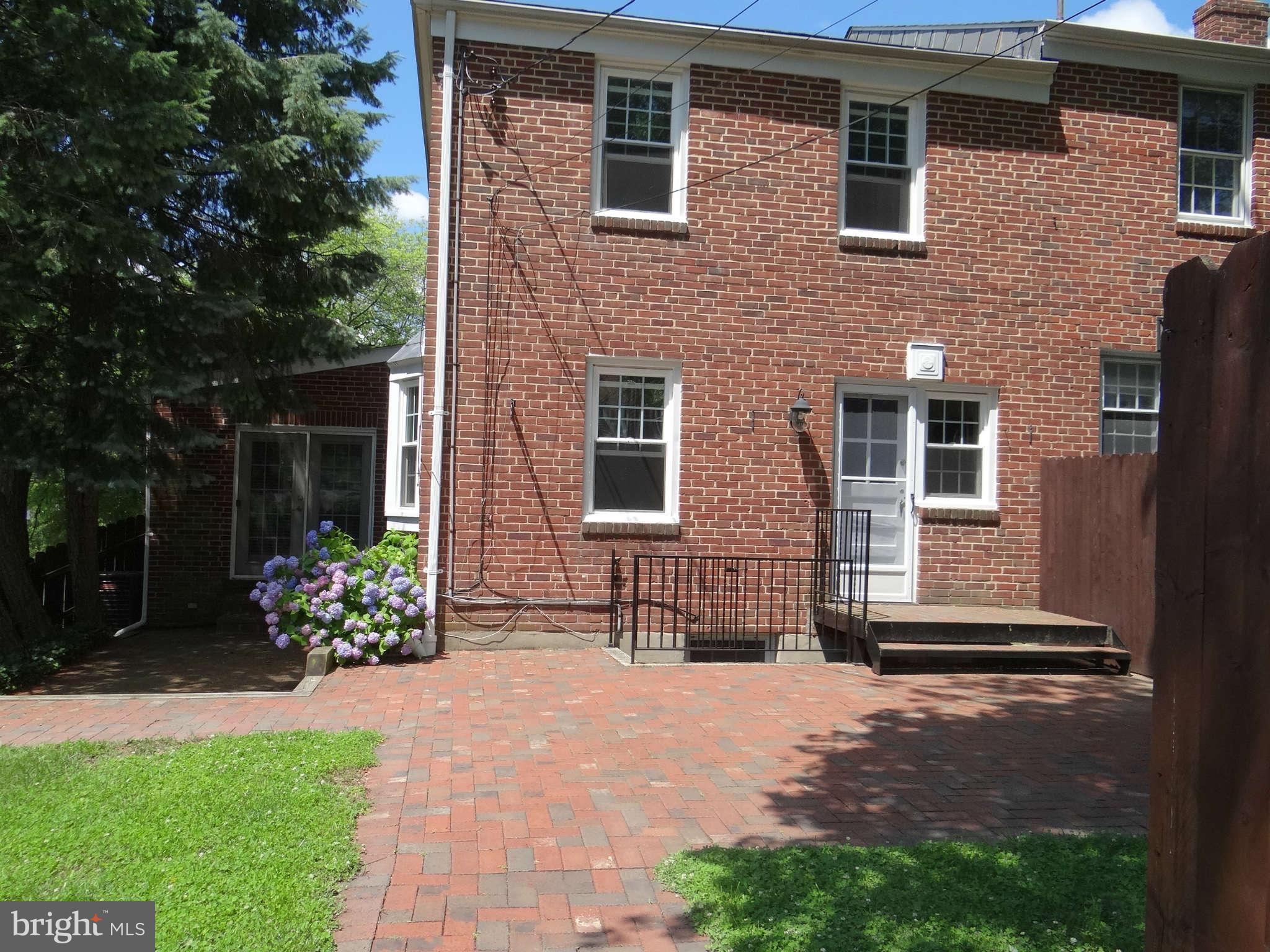 101 Stanmore Road Baltimore, MD 21212 - Photo 23 of 25 a front view of a house with a garden