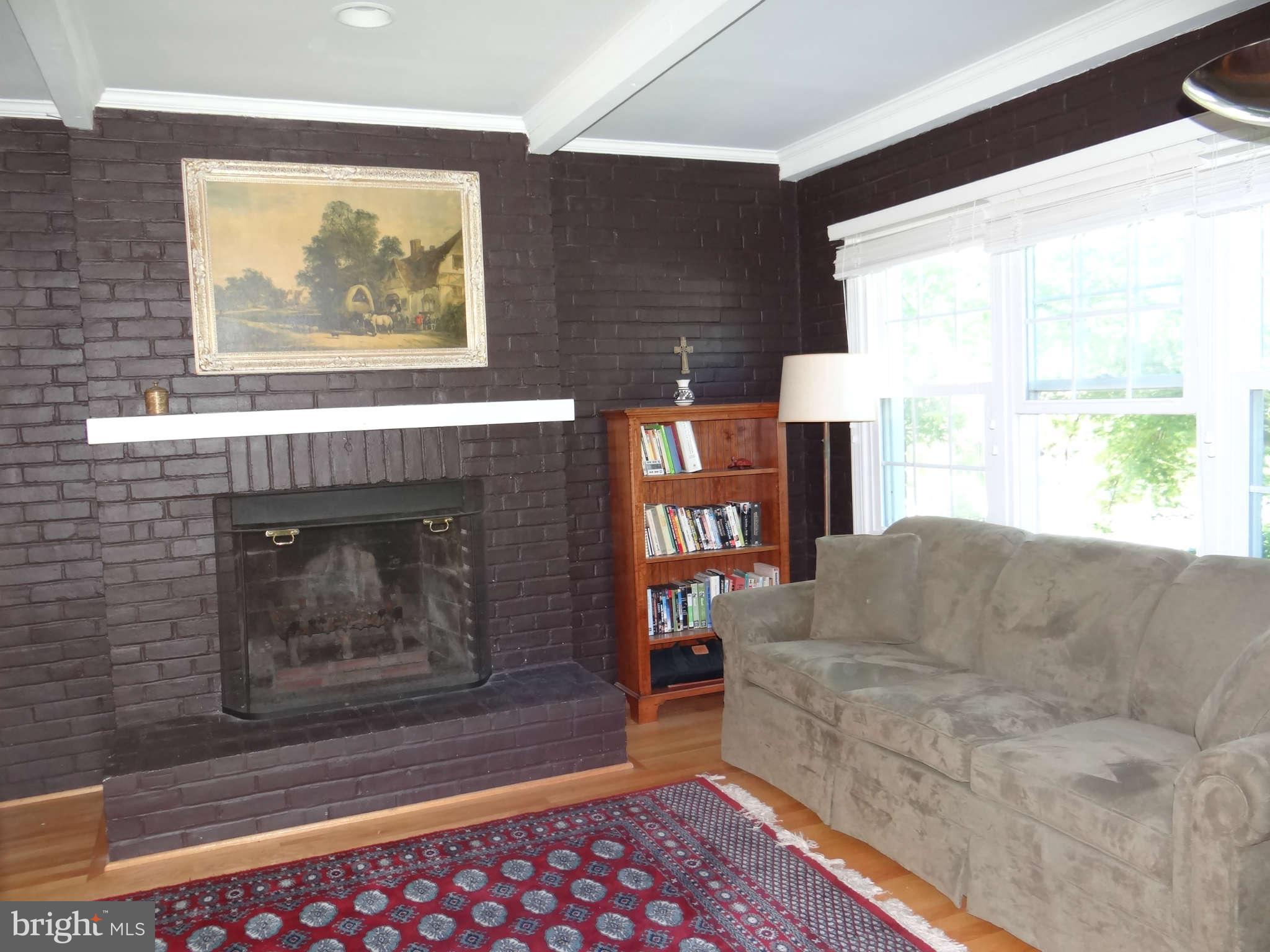 101 Stanmore Road Baltimore, MD 21212 - Photo 8 of 25 a living room with furniture and a fireplace