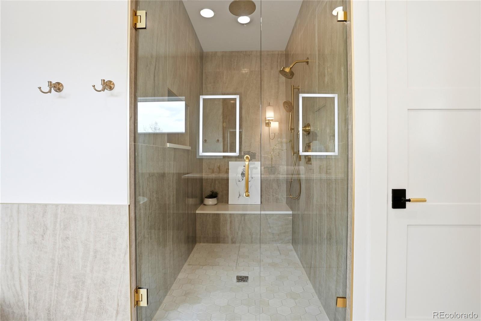 245 South Emerson Street Denver, CO 80209 - Photo 32 of 49 a bathroom with a glass shower door