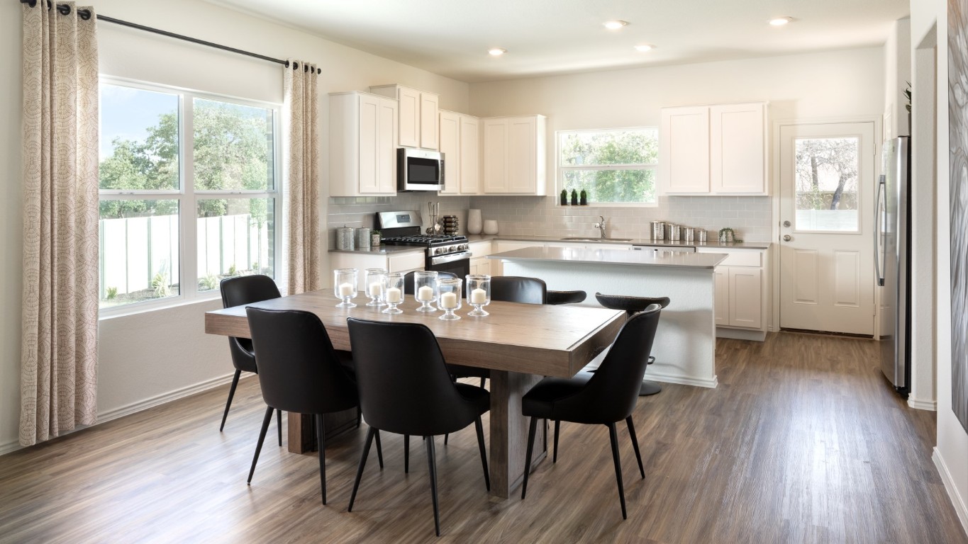 3275 Everett Kyle, TX 78640 - Photo 6 of 13 a view of a dining room with furniture and wooden floor