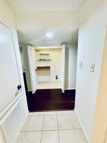 a bathroom with a granite countertop bathtub shower and toilet