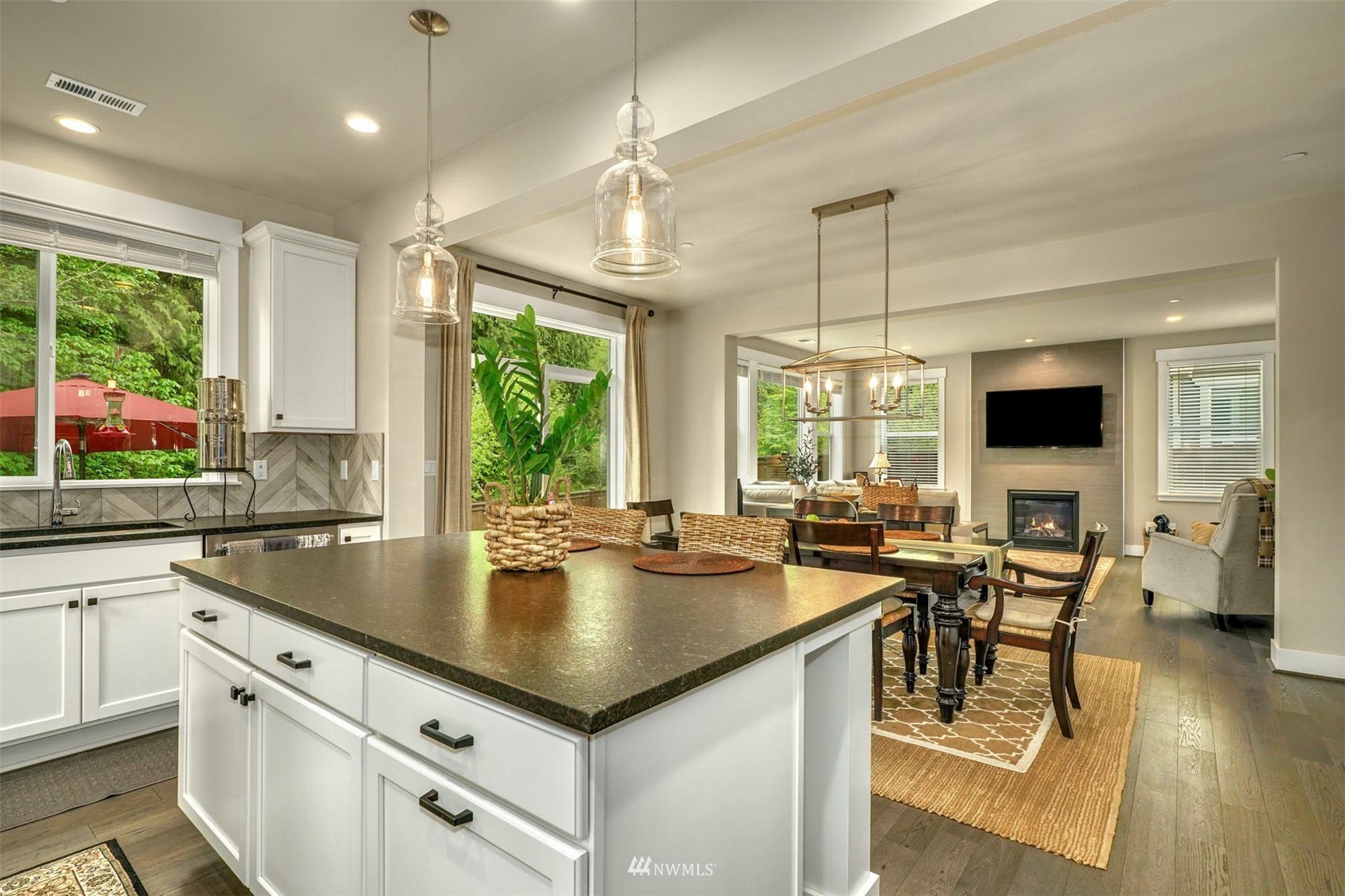 3312 238th Place Southeast Bothell, WA 98021 - Photo 11 of 40 a kitchen with sink cabinets and living room view