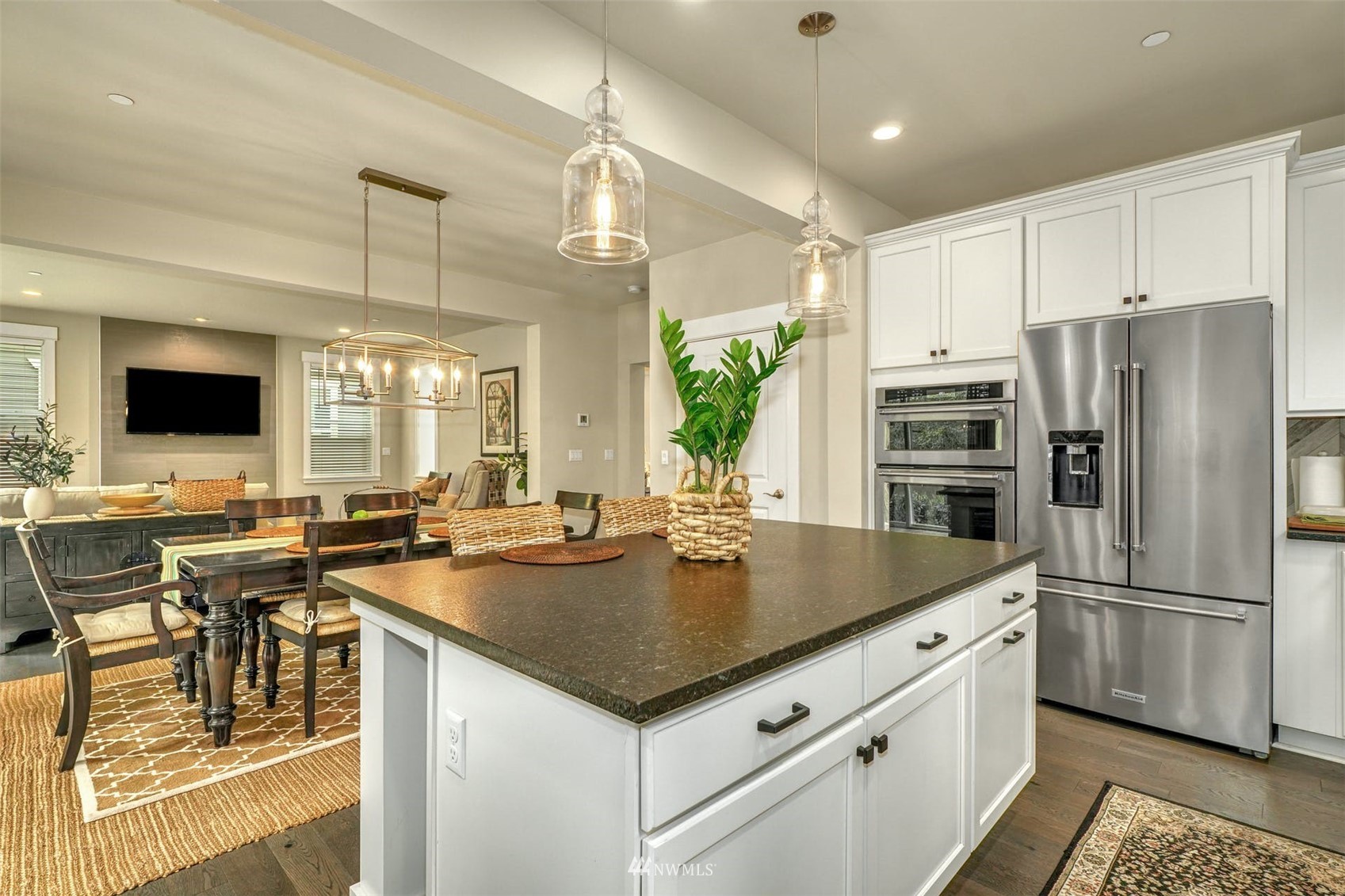 3312 238th Place Southeast Bothell, WA 98021 - Photo 12 of 40 a kitchen with stainless steel appliances granite countertop a sink a stove and a refrigerator
