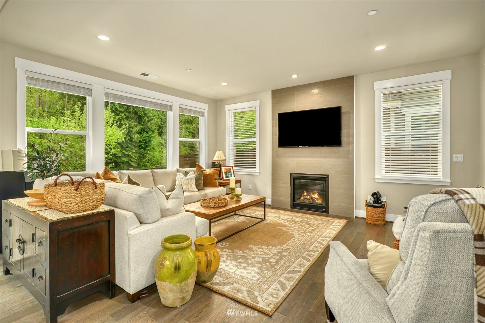 3312 238th Place Southeast Bothell, WA 98021 - Photo 13 of 40 a living room with fireplace furniture and a flat screen tv