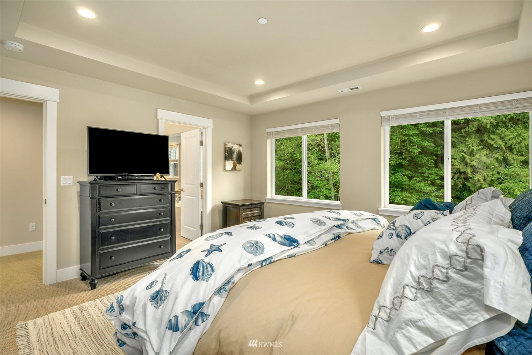 3312 238th Place Southeast Bothell, WA 98021 - Photo 22 of 40 a bedroom with a bed and a television