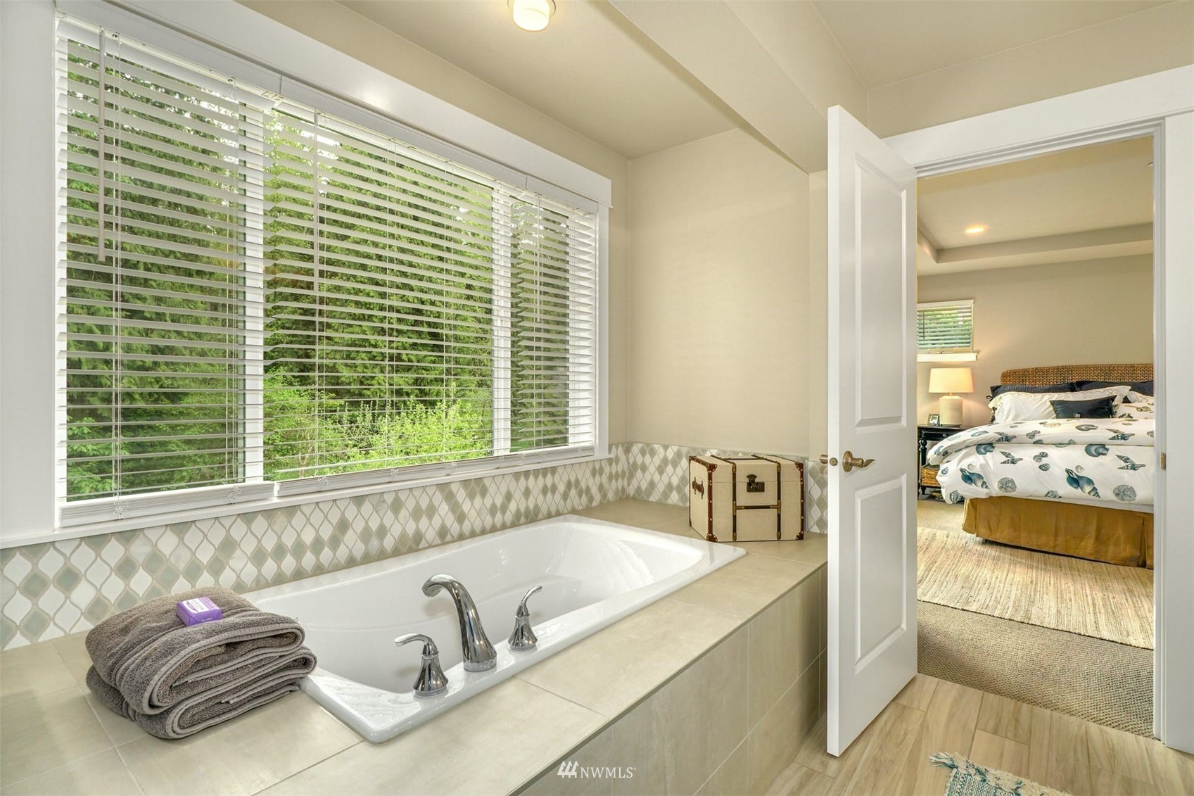 3312 238th Place Southeast Bothell, WA 98021 - Photo 25 of 40 a bath room with a bed and a large window