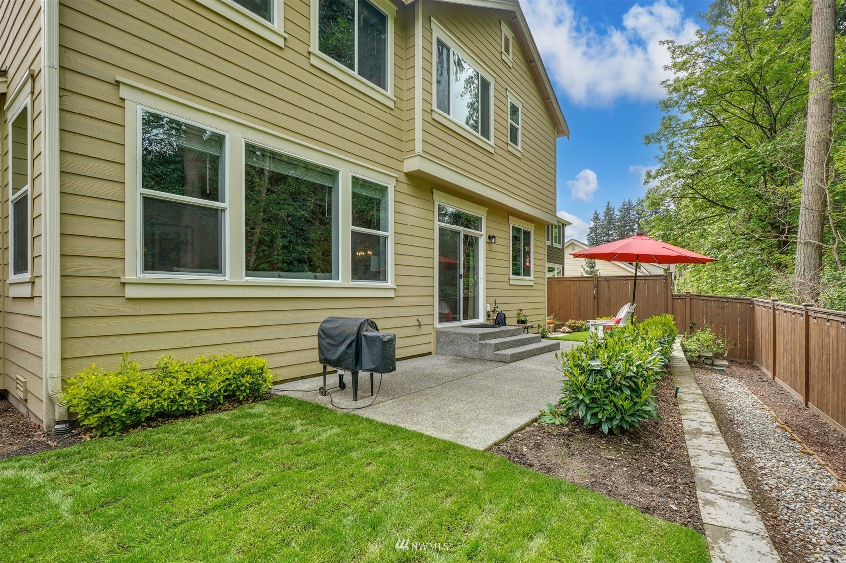 3312 238th Place Southeast Bothell, WA 98021 - Photo 32 of 40 a view of a house with a yard and sitting area