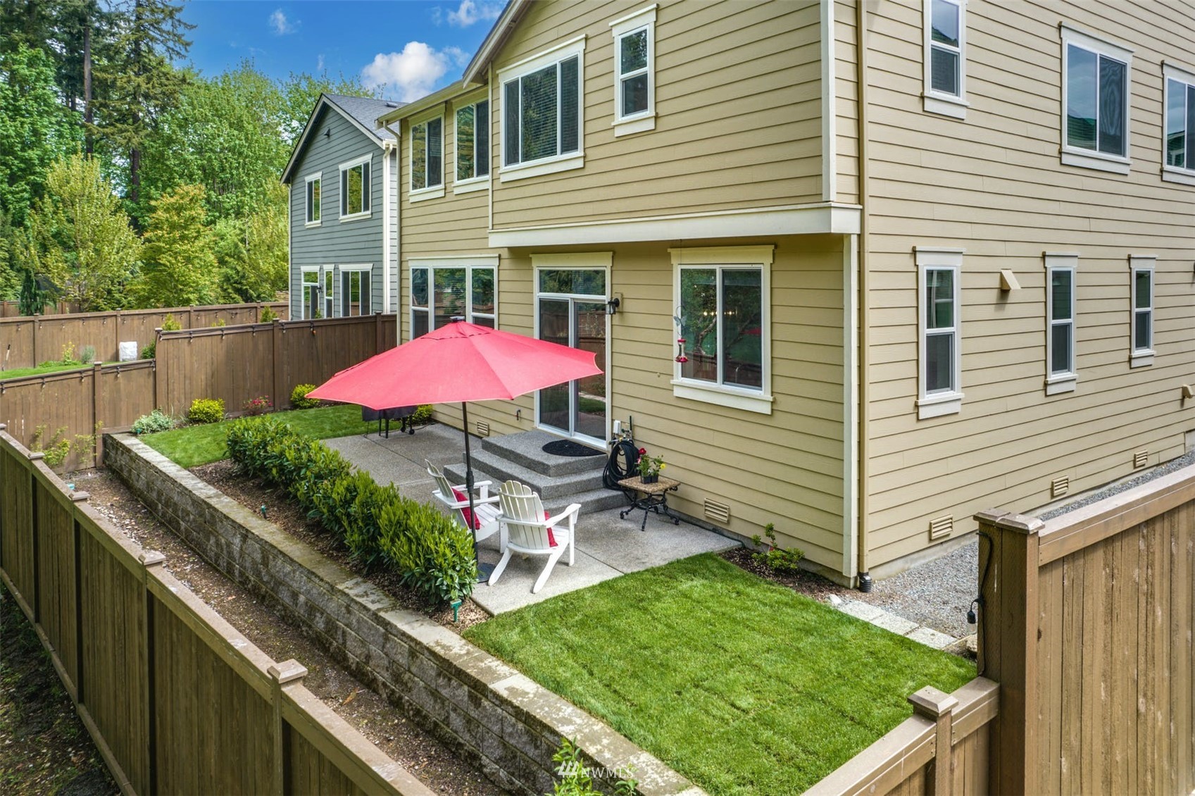 3312 238th Place Southeast Bothell, WA 98021 - Photo 33 of 40 a view of a backyard with a garden and outdoor seating