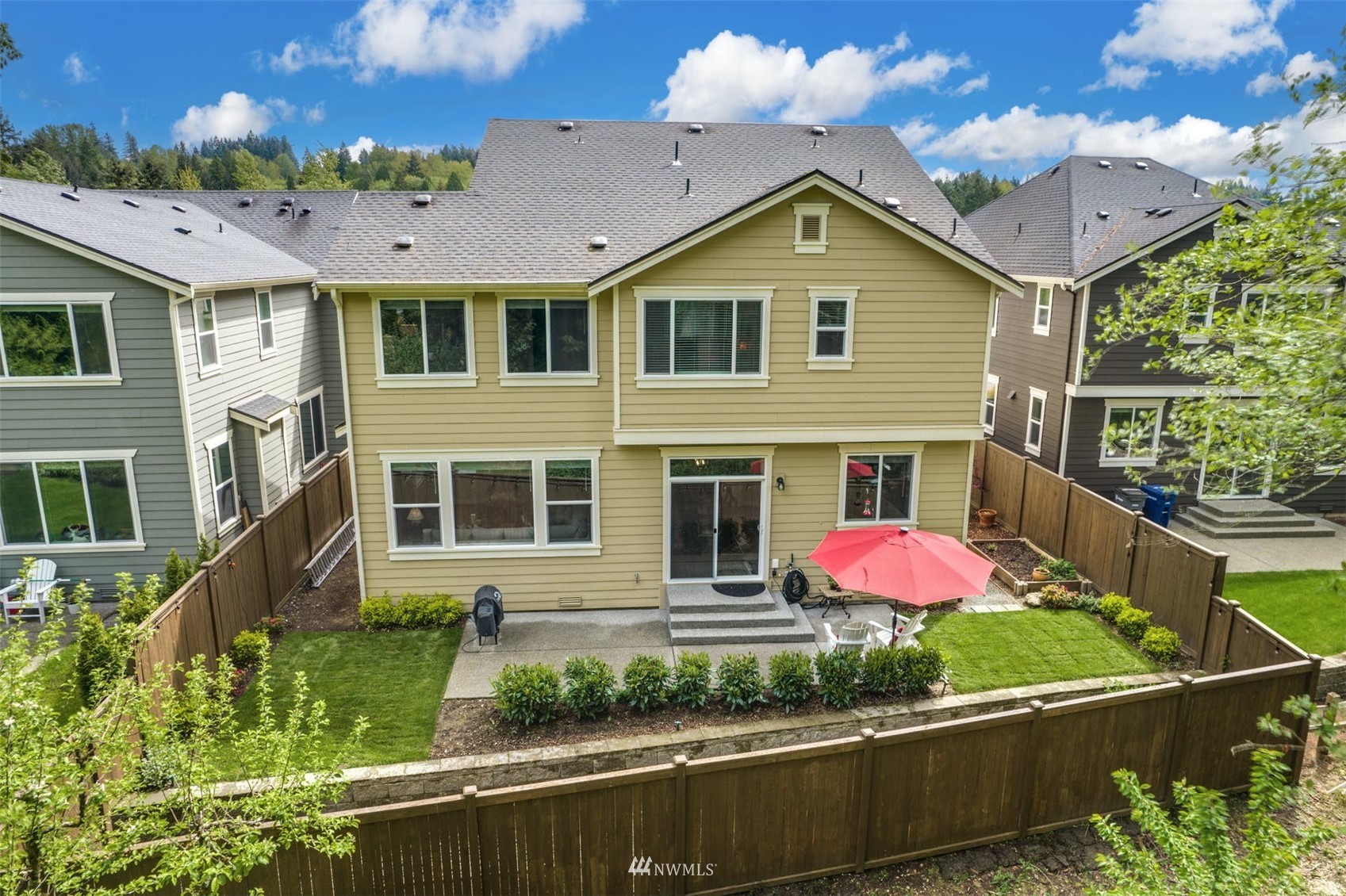 3312 238th Place Southeast Bothell, WA 98021 - Photo 37 of 40 a front view of a house with garden