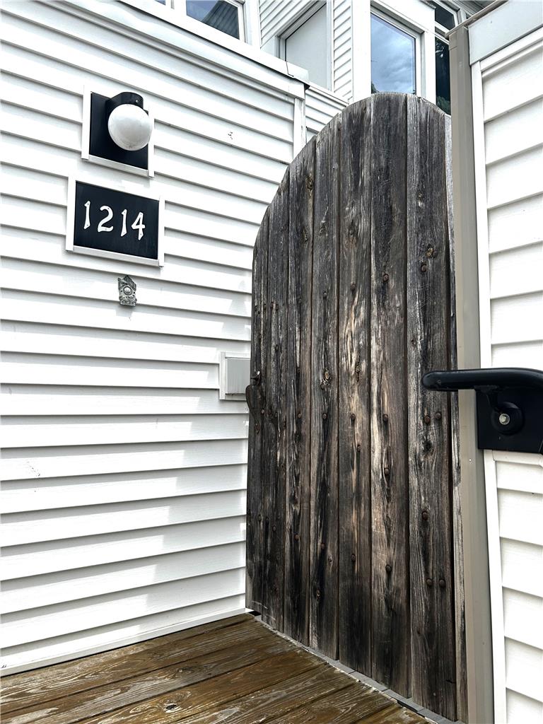 1214 Stanford Road Bethlehem, PA 18018 - Photo 7 of 58 Secure entry to a private yard, with sturdy wood siding and a welcoming porch.