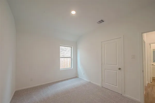 a view of empty room with windows