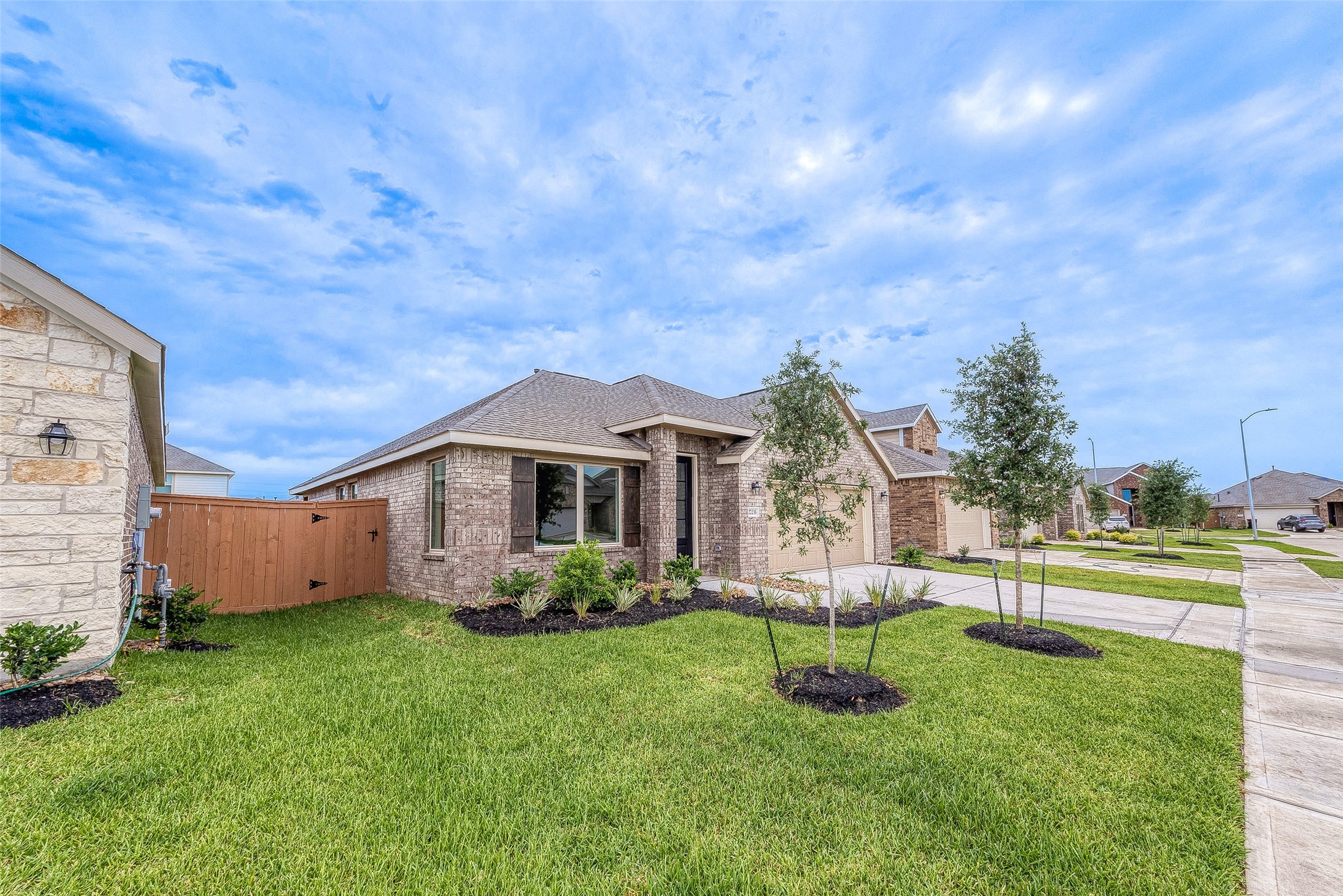 27235 Henley Rdg Drive Katy, TX 77493 - Photo 3 of 28 a front view of a house with garden