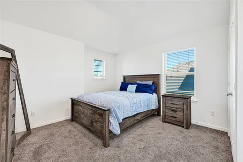 a bed room with a bed and a tv