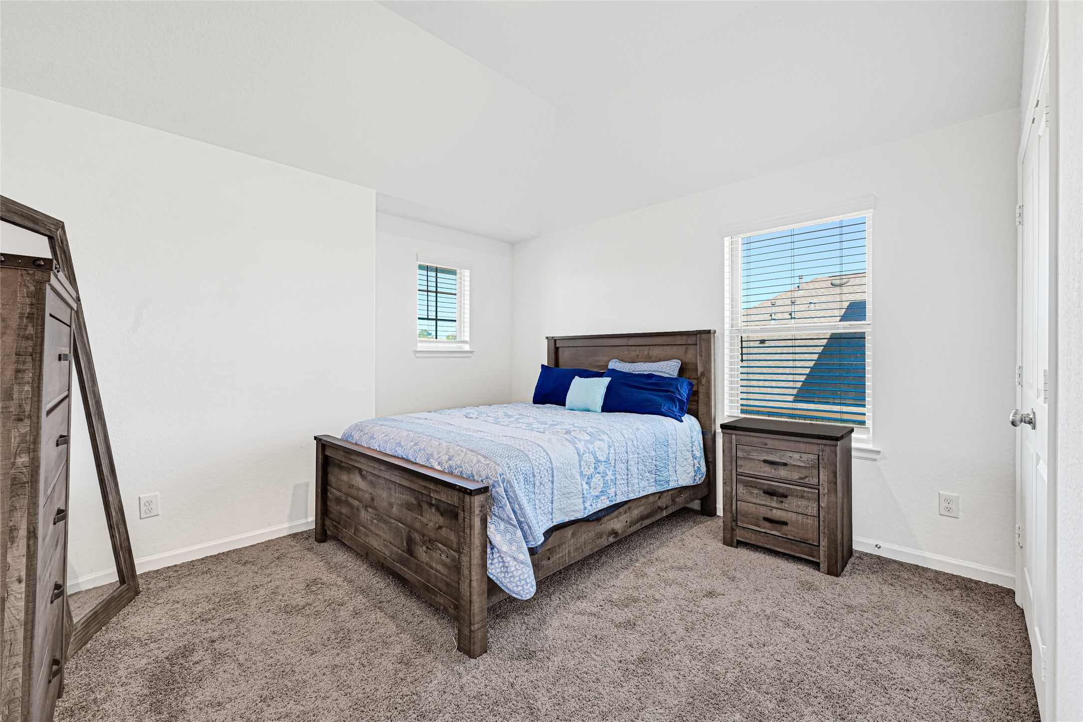 4307 Annandale Lane Rosharon, TX 77583 - Photo 17 of 31 a bed sitting in a bedroom next to a window