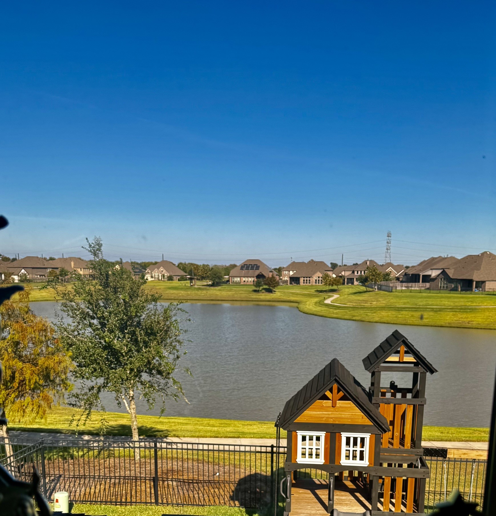 4307 Annandale Lane Rosharon, TX 77583 - Photo 25 of 31 View of backyard and lake view from the 2nd floor living space. Playset will convey with this home.