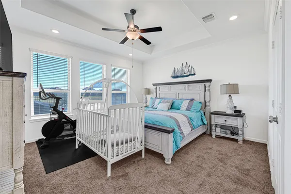 a bed room with a bed and a window