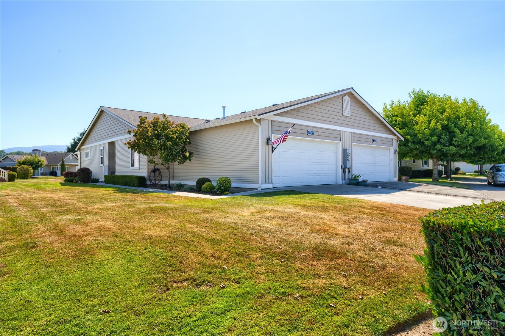1202 Decatur Circle, Unit 20B Burlington, WA 98233 - Photo 1 of 31 a front view of house with yard and garage