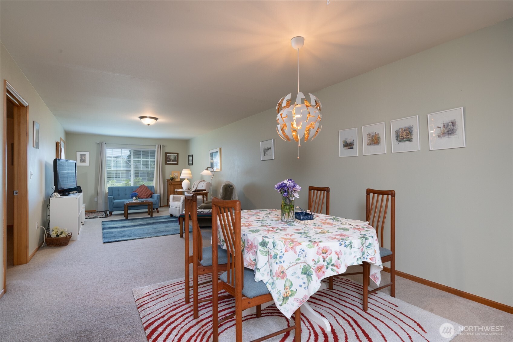 1202 Decatur Circle, Unit 20B Burlington, WA 98233 - Photo 11 of 31 a view of a dining room with furniture and chandelier