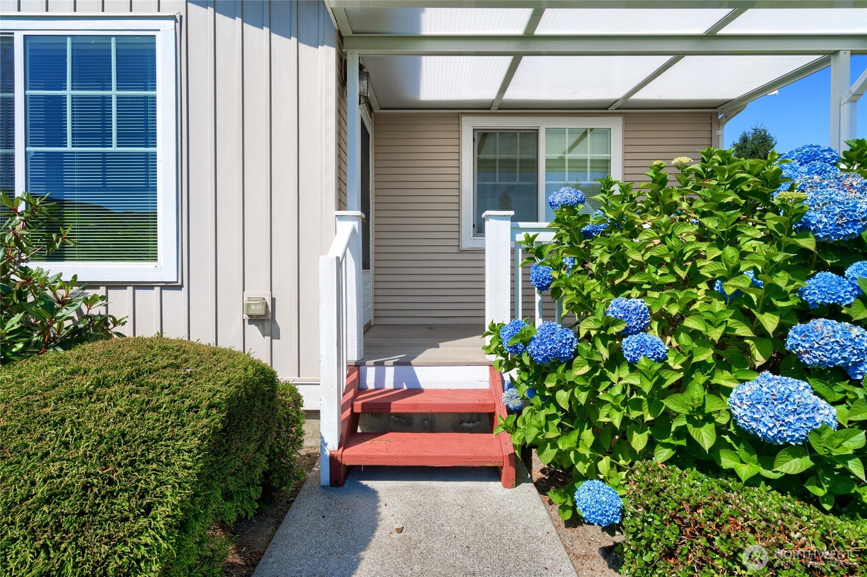 1202 Decatur Circle, Unit 20B Burlington, WA 98233 - Photo 23 of 31 a house with a flower garden