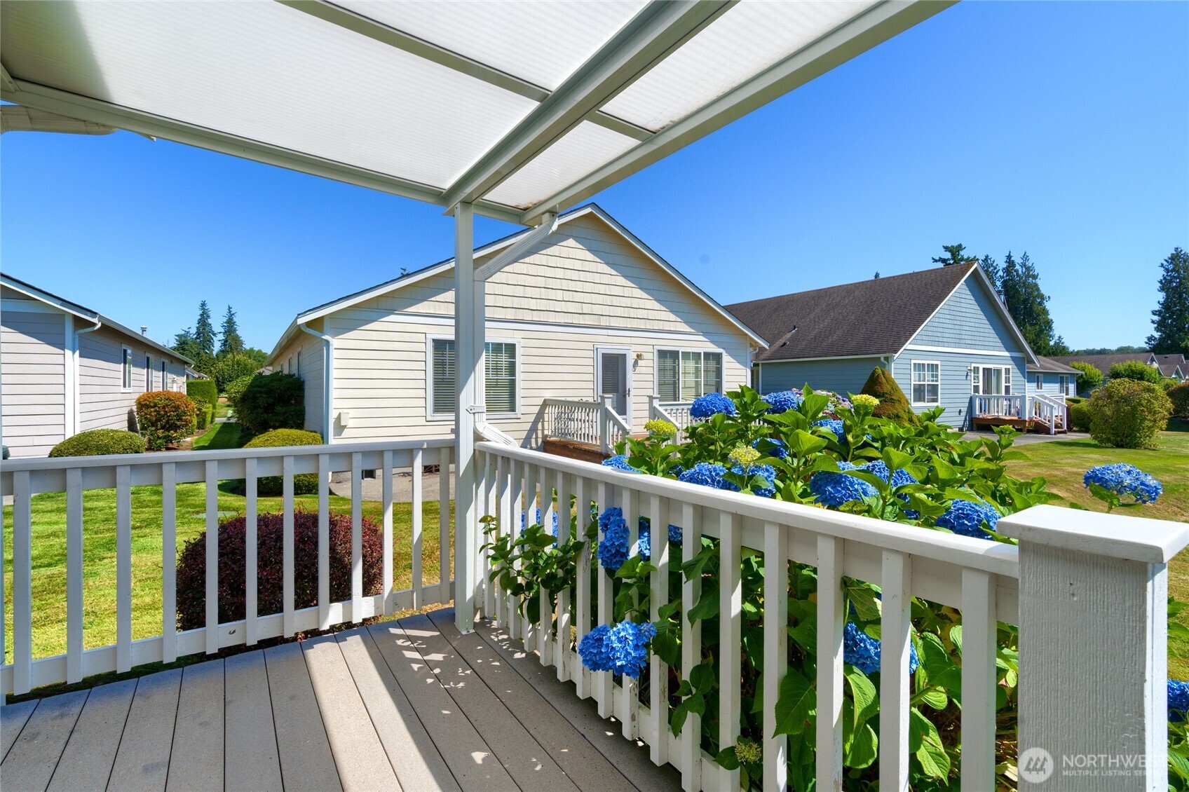 1202 Decatur Circle, Unit 20B Burlington, WA 98233 - Photo 24 of 31 a view of a house with wooden deck