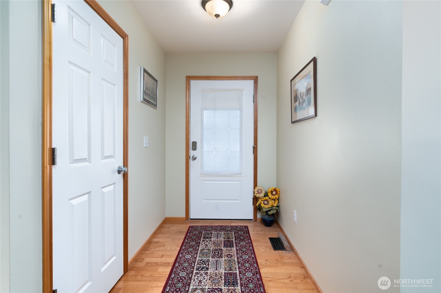 1202 Decatur Circle, Unit 20B Burlington, WA 98233 - Photo 5 of 31 a view of hallway with wooden floor