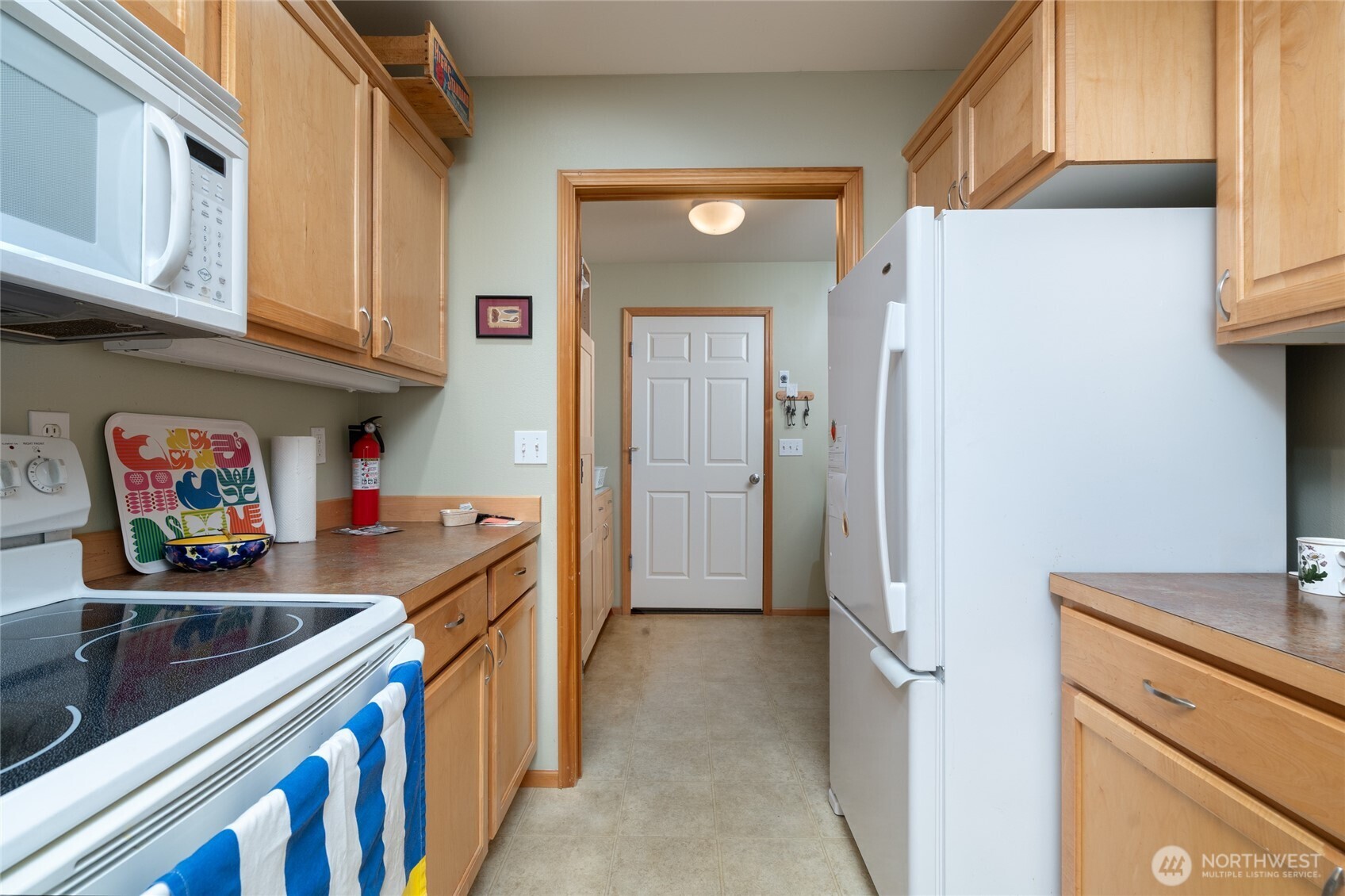 1202 Decatur Circle, Unit 20B Burlington, WA 98233 - Photo 7 of 31 a kitchen with stainless steel appliances granite countertop a refrigerator and a sink