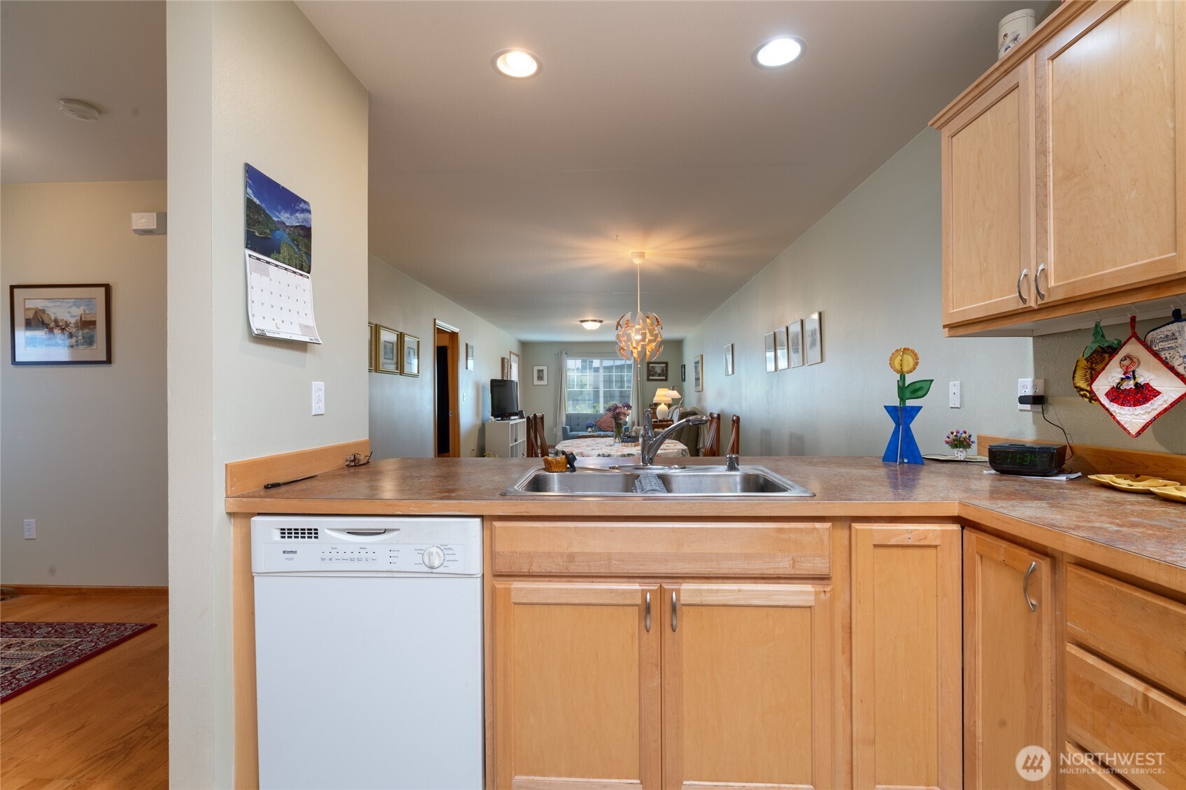 1202 Decatur Circle, Unit 20B Burlington, WA 98233 - Photo 8 of 31 a room with stainless steel appliances kitchen island granite countertop a sink and cabinets