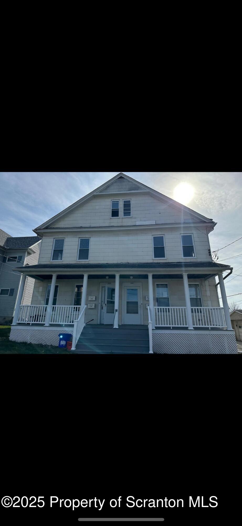 a black and white building with glass windows