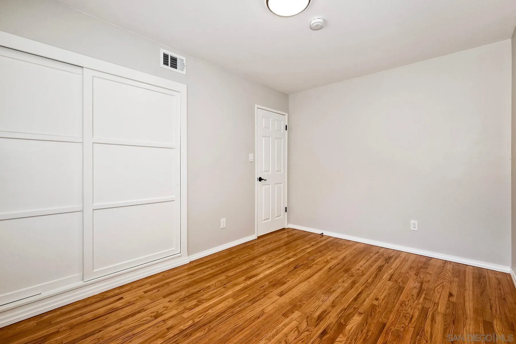 9307 Manor Drive La Mesa, CA 91942 - Photo 17 of 29 a view of a room with wooden floor