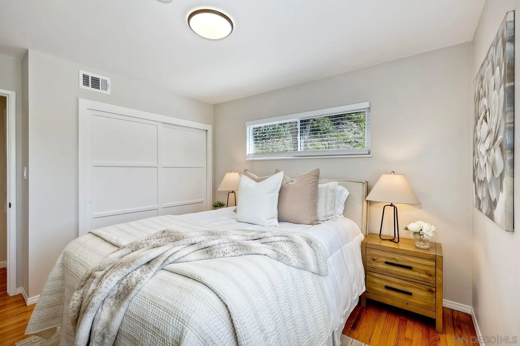 9307 Manor Drive La Mesa, CA 91942 - Photo 19 of 29 a bedroom with a bed and a window