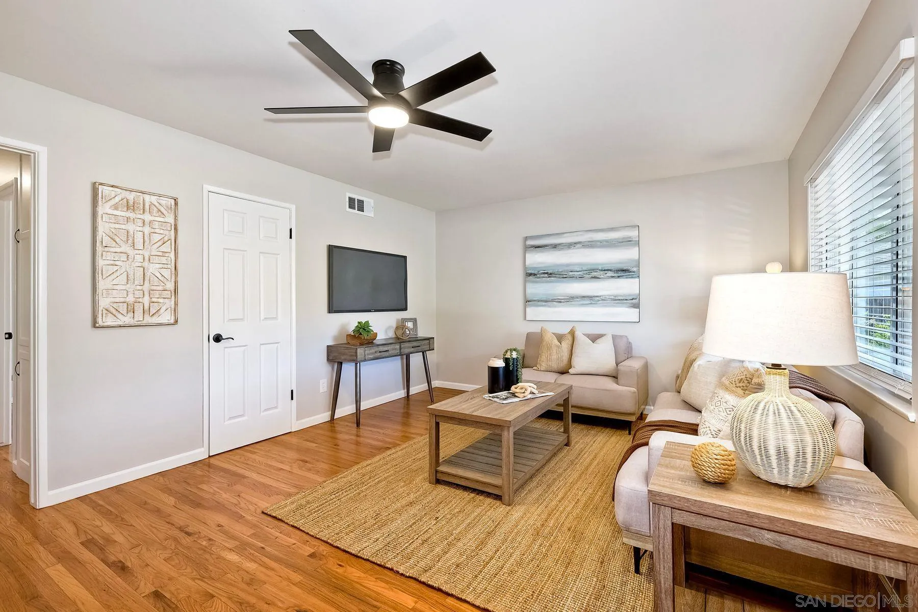 9307 Manor Drive La Mesa, CA 91942 - Photo 3 of 29 a living room with furniture and a wooden floor