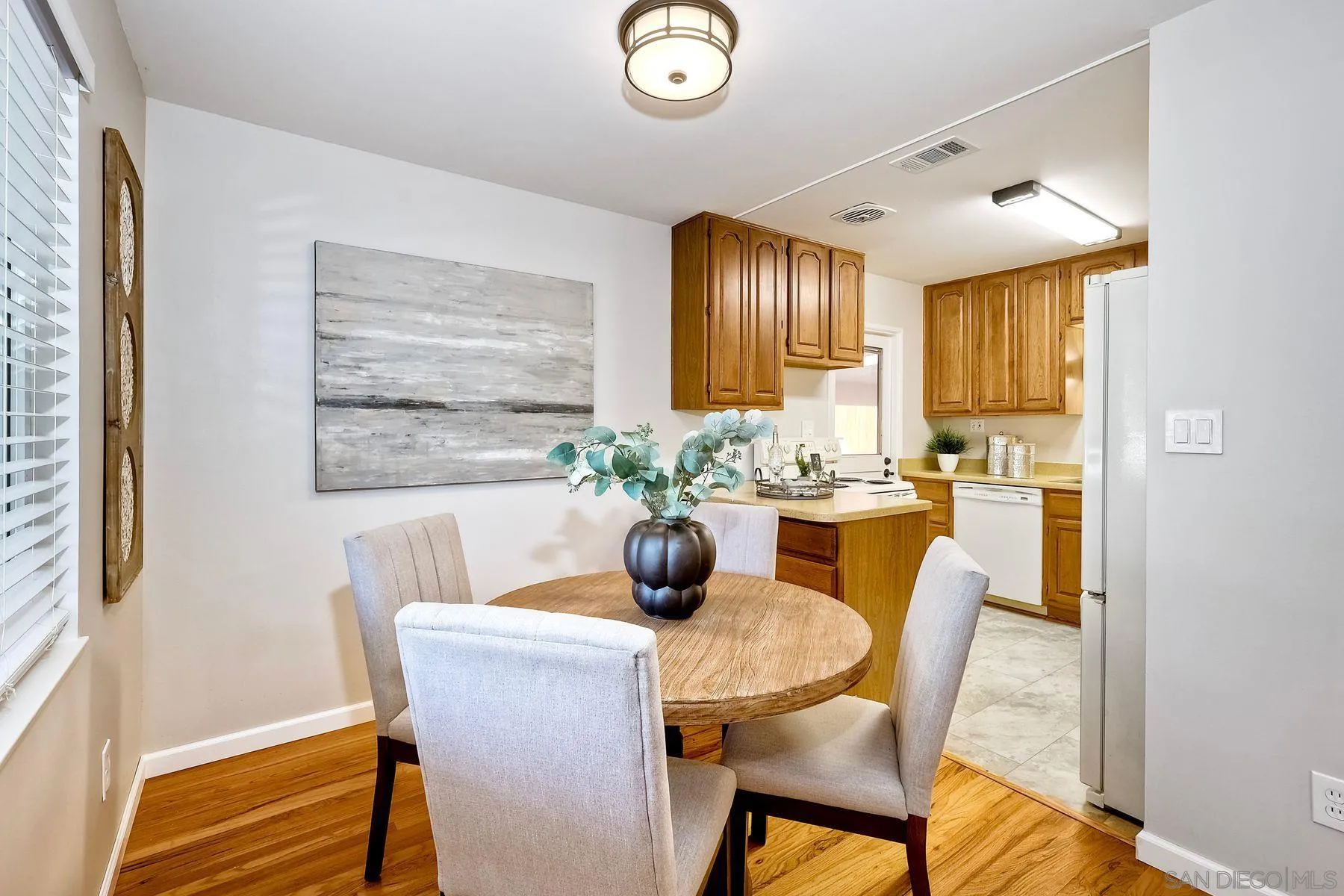 9307 Manor Drive La Mesa, CA 91942 - Photo 7 of 29 a view of a dining room with furniture window and wooden floor