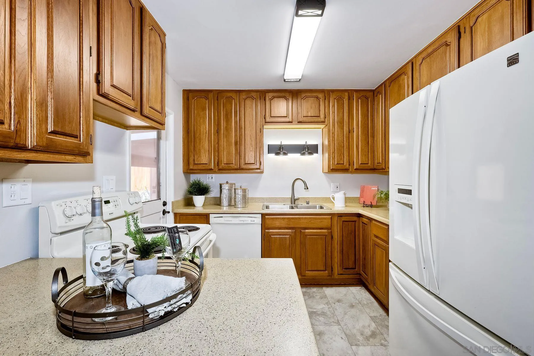 9307 Manor Drive La Mesa, CA 91942 - Photo 10 of 29 a kitchen with a sink appliances and cabinets