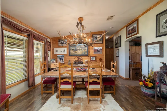 a bedroom with furniture and wooden floor
