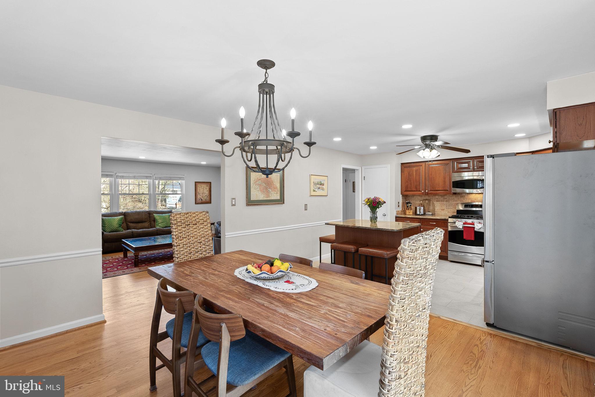 4119 27th Road North Arlington, VA 22207 - Photo 11 of 53 a view of a dining room with furniture a chandelier and wooden floor