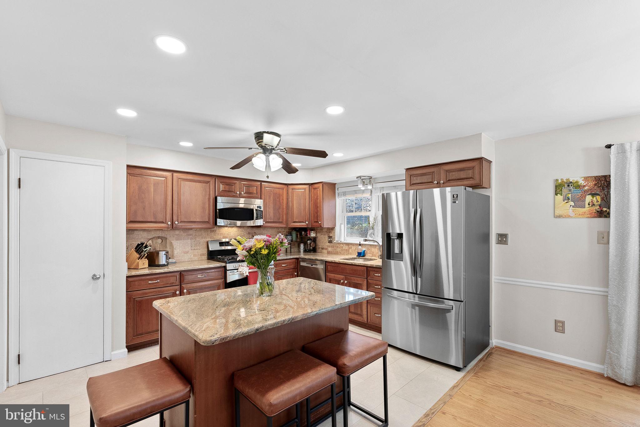 4119 27th Road North Arlington, VA 22207 - Photo 14 of 53 a kitchen with stainless steel appliances a refrigerator and a stove top oven