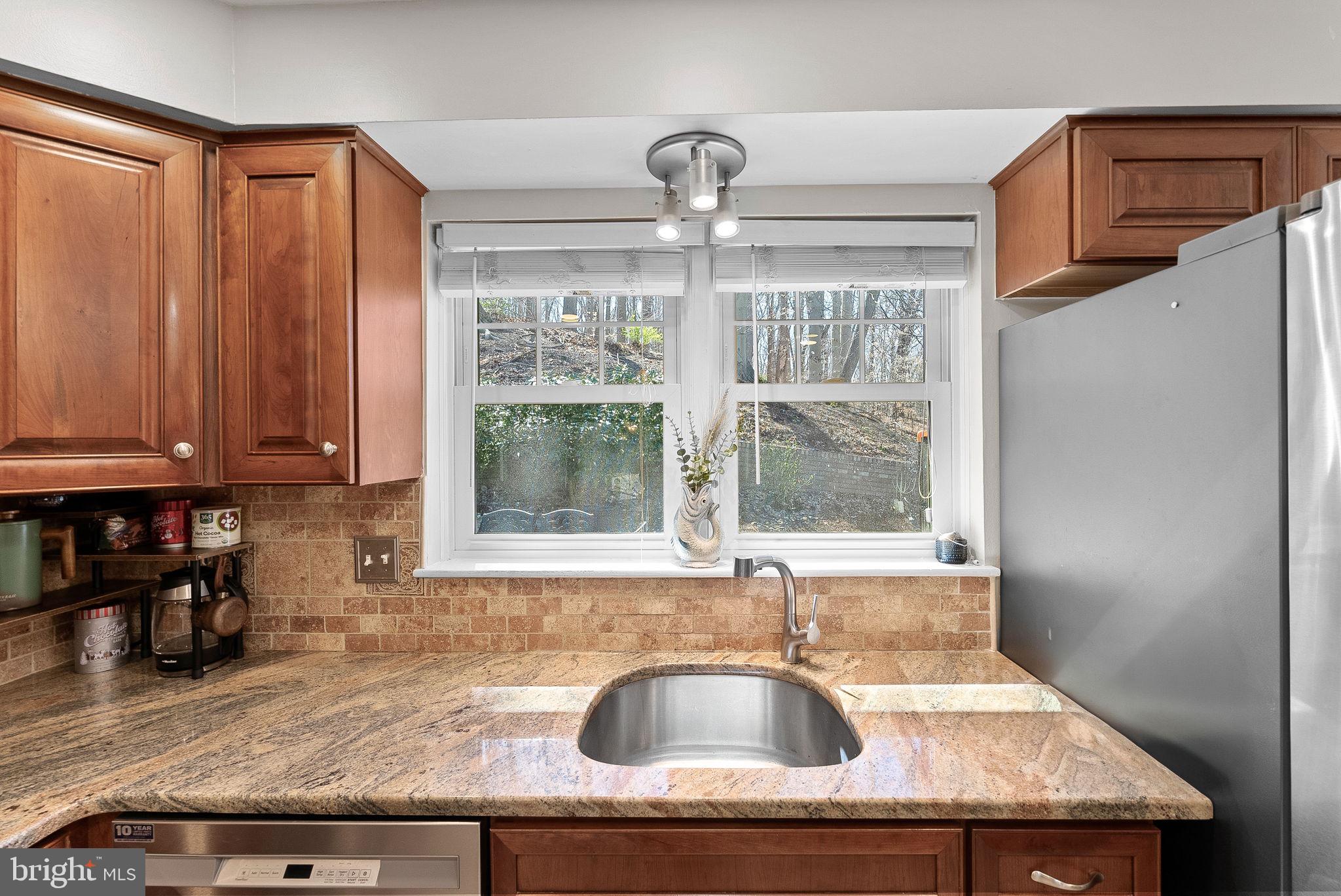 4119 27th Road North Arlington, VA 22207 - Photo 17 of 53 a kitchen with granite countertop a sink and a window