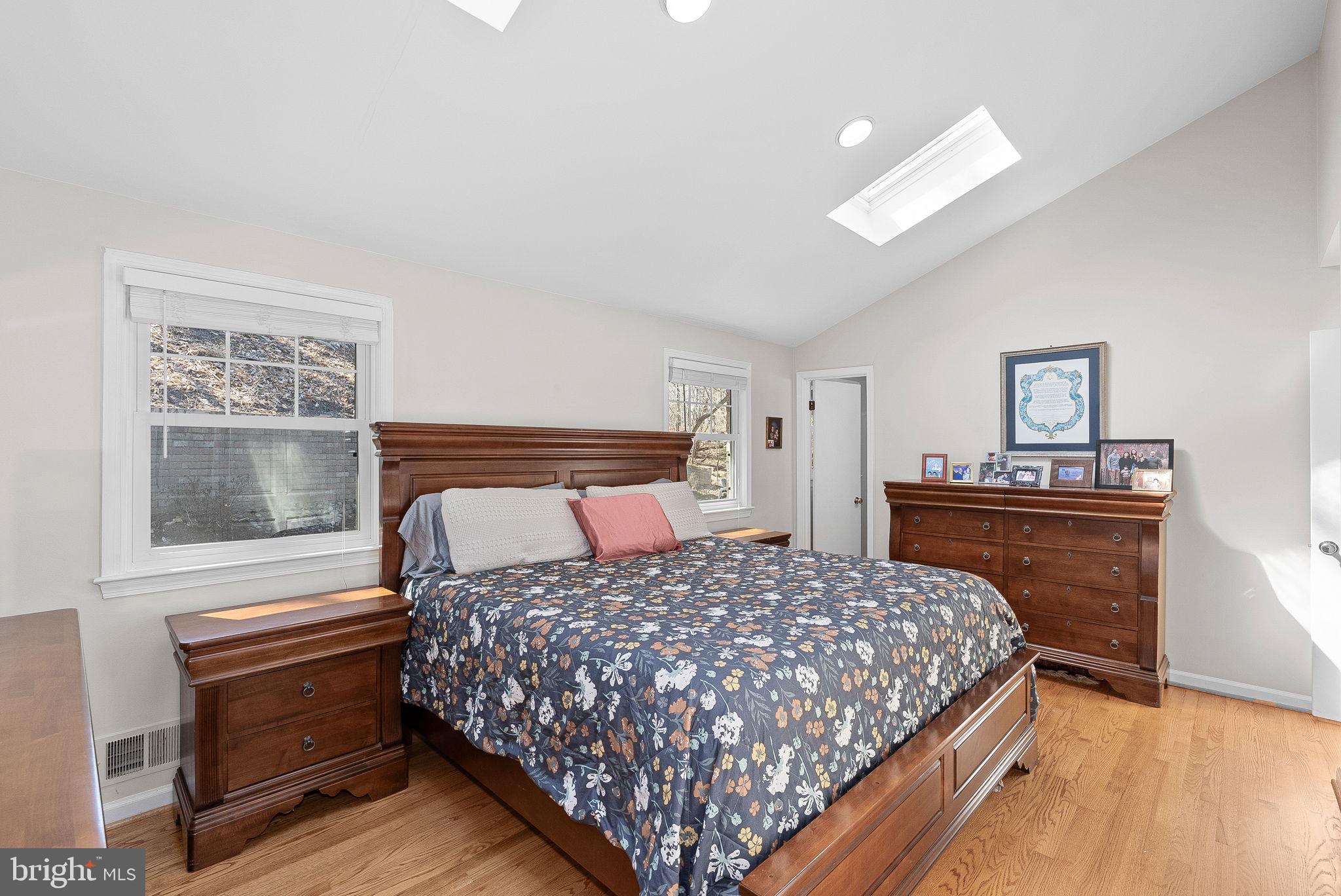 4119 27th Road North Arlington, VA 22207 - Photo 21 of 53 a bedroom with a bed and dresser with mirror