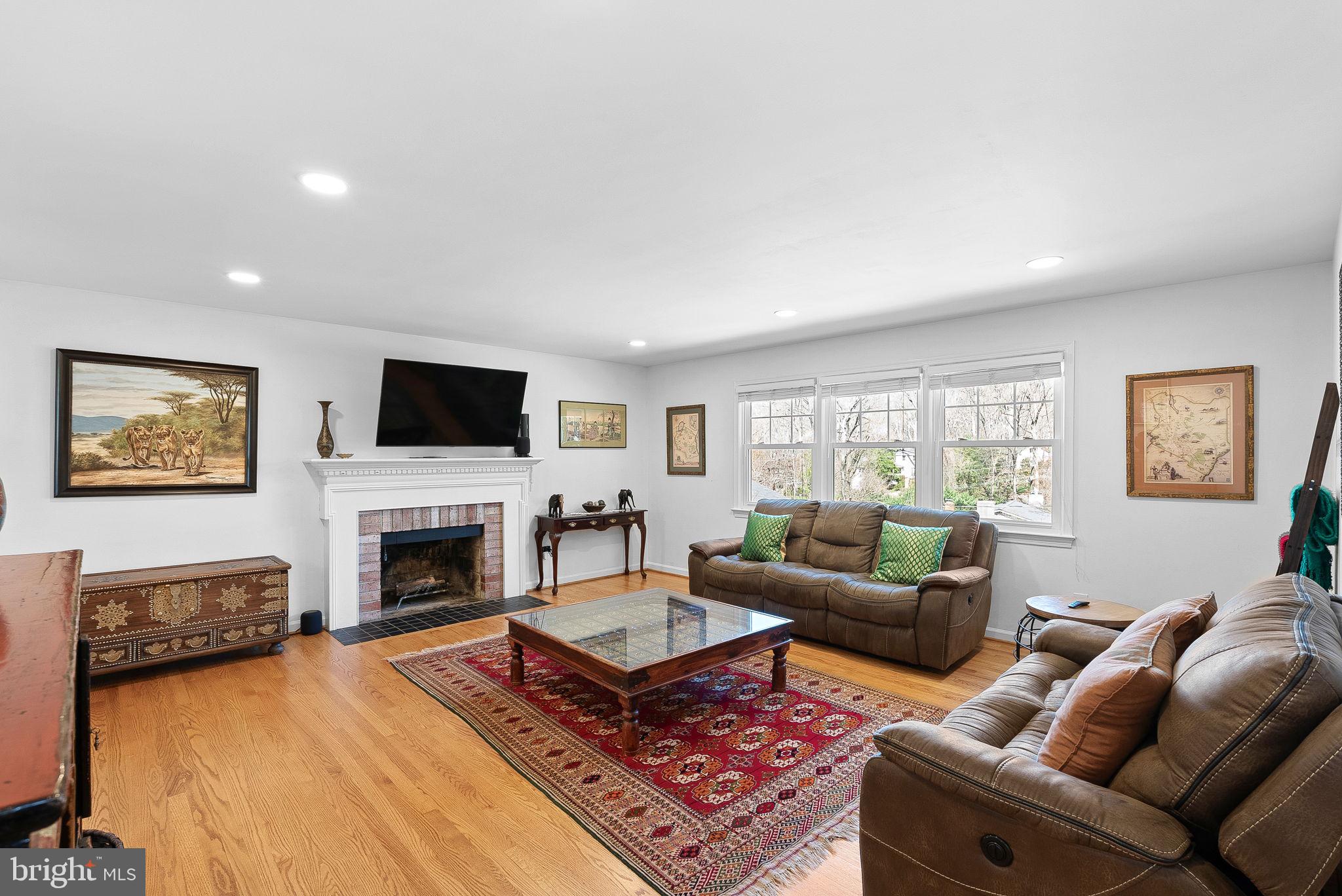 4119 27th Road North Arlington, VA 22207 - Photo 3 of 53 a living room with furniture a rug and a fireplace