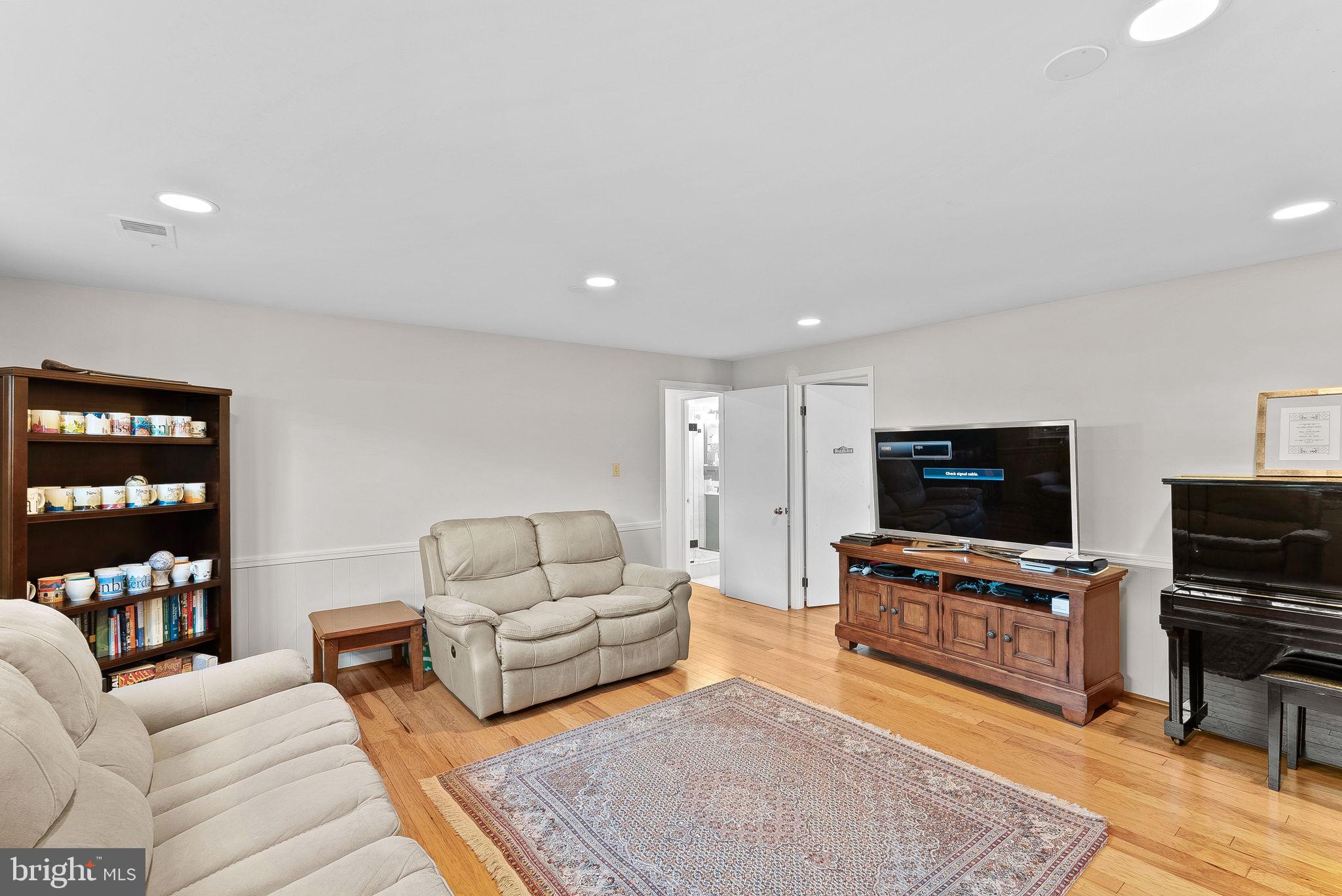 4119 27th Road North Arlington, VA 22207 - Photo 31 of 53 a living room with furniture and a flat screen tv