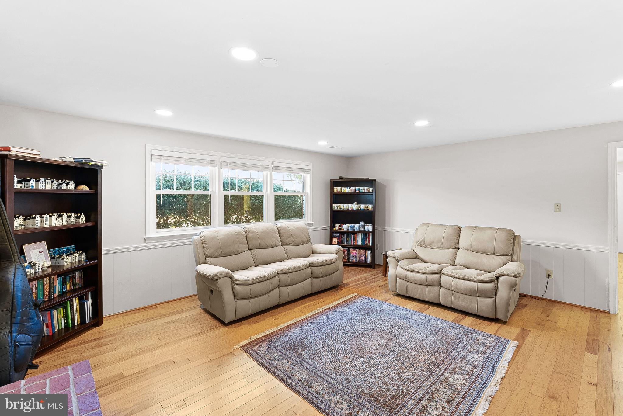 4119 27th Road North Arlington, VA 22207 - Photo 32 of 53 a living room with furniture and a book shelf