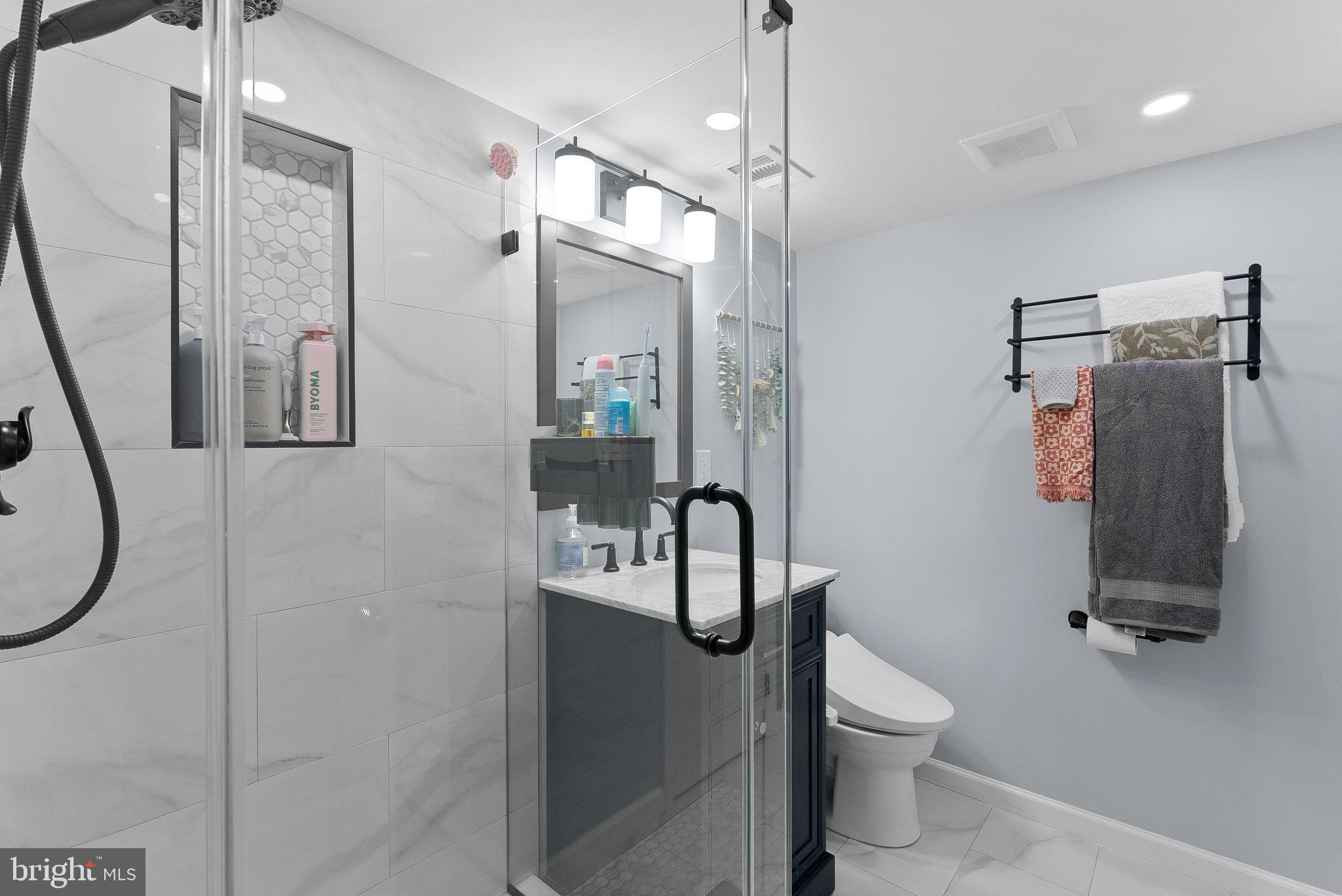 4119 27th Road North Arlington, VA 22207 - Photo 36 of 53 a bathroom with a shower toilet and sink